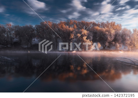 Winter Lake Landscape with Frosted Trees and Misty Sunrise Winter Lake Landscape with Frosted Trees and Misty Sunrise 142372195