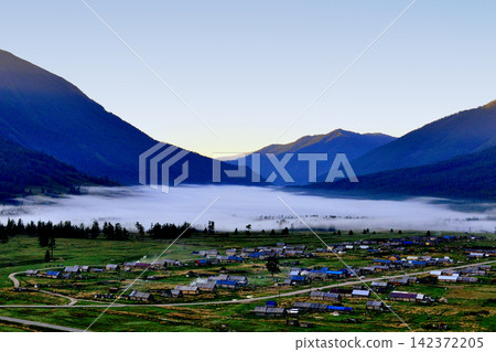 Mountain Valley Village with Morning Fog and Dawn Light Mountain Valley Village with Morning Fog and Dawn Light 142372205