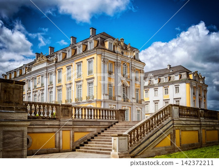 Baroque Palace Exterior with Grand Staircase and Dramatic Sky Baroque Palace Exterior with Grand Staircase and Dramatic Sky 142372211
