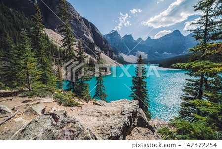 Turquoise Mountain Lake and Pine Forest Landscape Turquoise Mountain Lake and Pine Forest Landscape 142372254