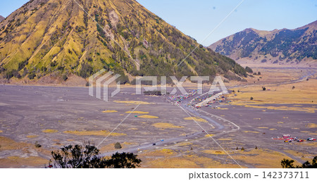 Beautiful morning view of Mount Bromo and Mount Semeru, East Java, Indonesia. Beautiful morning view of Mount Bromo and Mount Semeru, East Java, Indonesia. 142373711
