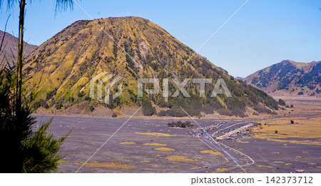 Beautiful morning view of Mount Bromo and Mount Semeru, East Java, Indonesia. Beautiful morning view of Mount Bromo and Mount Semeru, East Java, Indonesia. 142373712