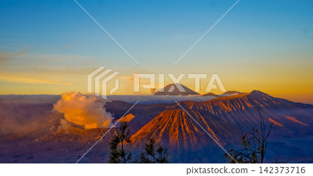 Beautiful morning view of Mount Bromo and Mount Semeru, East Java, Indonesia. 142373716