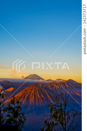 Beautiful morning view of Mount Bromo and Mount Semeru, East Java, Indonesia. Beautiful morning view of Mount Bromo and Mount Semeru, East Java, Indonesia. 142373717