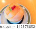 A refreshing fruit dessert beautifully garnished with thinly sliced peaches. 142373852