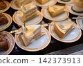Various fruit and chocolate cakes displayed in the showcase of a Western-style confectionery shop. 142373913
