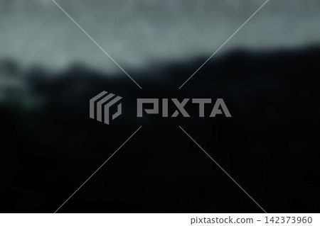 A blurred, monochrome abstract image texture with a blade pattern emerging from a black ink-colored background. 142373960