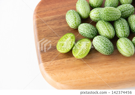 Cross-section of a sliced mini cucumber Cross-section of a sliced mini cucumber 142374456