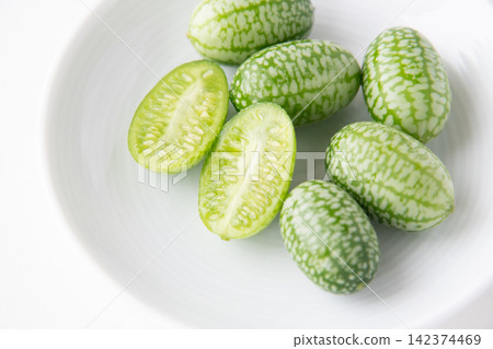 Cross-section of a sliced mini cucumber Cross-section of a sliced mini cucumber 142374469
