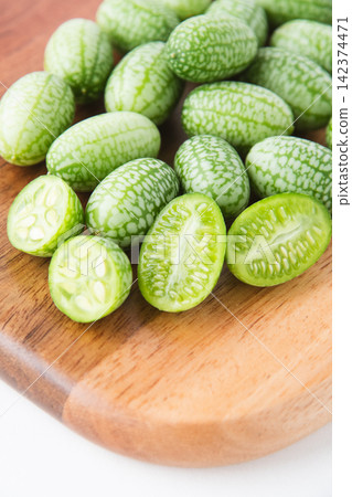 Cross-section of a sliced mini cucumber Cross-section of a sliced mini cucumber 142374471