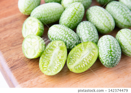 Cross-section of a sliced mini cucumber Cross-section of a sliced mini cucumber 142374479