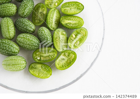 Cross-section of a sliced mini cucumber Cross-section of a sliced mini cucumber 142374489