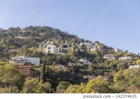 Upscale Mediterranean villas cling to steep volcanic rocks of the Esterel Massif between Cannes and Nice. 142374635