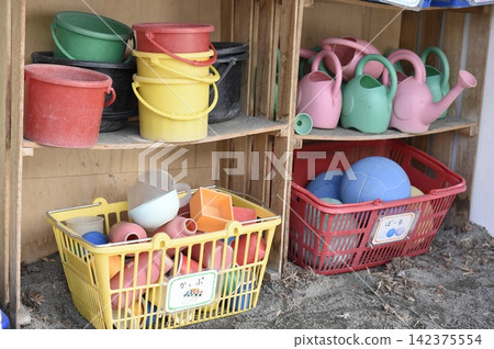 Buckets and playground equipment placed in the nursery school yard Buckets and playground equipment placed in the nursery school yard 142375554