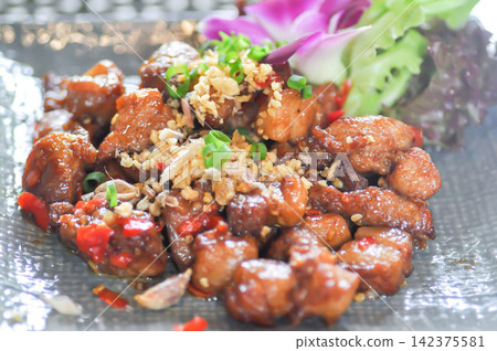 stir fried pork or deep fried pork , stir fried pork with garlic and chili stir fried pork or deep fried pork , stir fried pork with garlic and chili 142375581