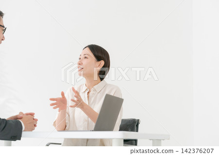 A man in a suit and a female customer A man in a suit and a female customer 142376207