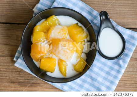 cassava food on the table food, sweet dessert made of boiled cassava, sugar and coconut milik - Thai food cassava food on the table food, sweet dessert made of boiled cassava, sugar and coconut milik - Thai food 142376372