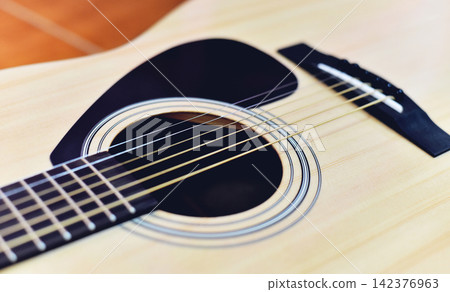 Acoustic guitar / Close up of guitar musical instrument tone vintage style classic Acoustic guitar / Close up of guitar musical instrument tone vintage style classic 142376963