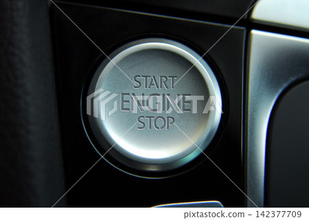 Car Engine Start Stop Button in Modern Dashboard Close-Up Car Engine Start Stop Button in Modern Dashboard Close-Up 142377709
