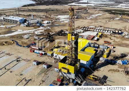 Aerial View of Oil Drilling Rig at Remote Industrial Site Aerial View of Oil Drilling Rig at Remote Industrial Site 142377762