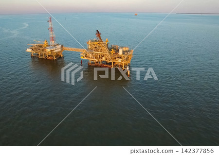 Offshore Oil Platform in Blue Sea Aerial Industrial Energy View Offshore Oil Platform in Blue Sea Aerial Industrial Energy View 142377856