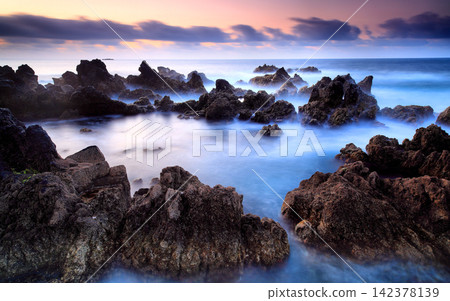 Rocky Seascape at Sunset with Long Exposure Waves Rocky Seascape at Sunset with Long Exposure Waves 142378139