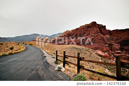 Desert Road Through Red Rock Canyon Landscape 142378188
