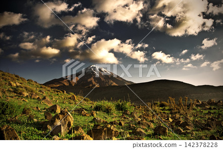 Snow-Capped Volcano Landscape with Dramatic Clouds Snow-Capped Volcano Landscape with Dramatic Clouds 142378228