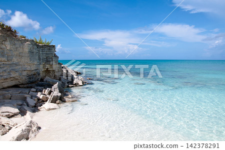 Tropical Beach with Turquoise Water and Rocky Limestone Coast Tropical Beach with Turquoise Water and Rocky Limestone Coast 142378291