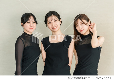 Beauty portraits of three women in black fashion, smiling elegantly. Beauty portraits of three women in black fashion, smiling elegantly. 142378634