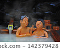 An elderly couple enjoying a private family bath at a hot spring resort. 142379428