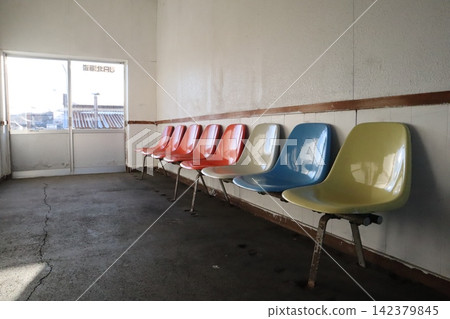 Colorful chairs at an unmanned train station 142379845