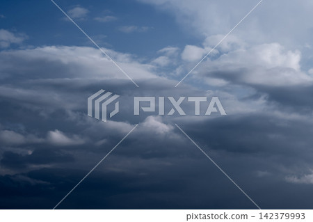 Dramatic Dark Storm Clouds in Blue Sky Dramatic Dark Storm Clouds in Blue Sky 142379993