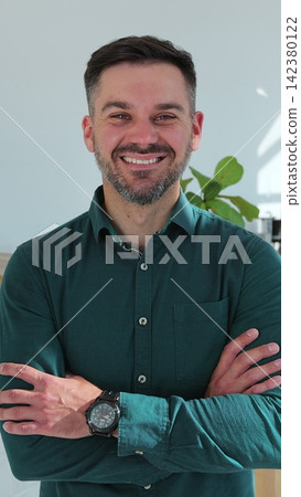 Vertical video. Portrait of successful male chef standing with folded arms in cafe against counter. Vertical video. Portrait of successful male chef standing with folded arms in cafe against counter. 142380122