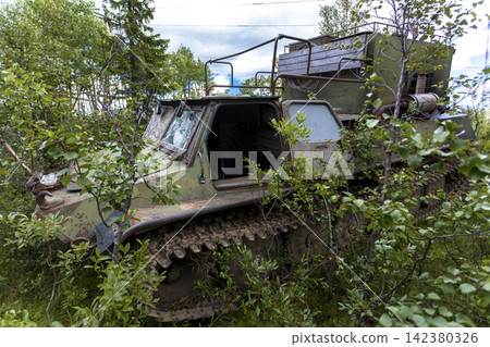 Old Soviet GT-SM GAZ-71 tracked all-terrain vehicle overgrown in forest in Murmansk Oblast, Russia 142380326