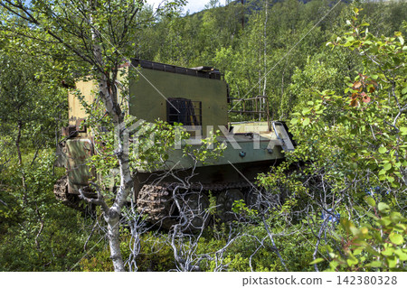 Old Soviet GT-SM GAZ-71 tracked all-terrain vehicle overgrown in forest in Murmansk Oblast, Russia Old Soviet GT-SM GAZ-71 tracked all-terrain vehicle overgrown in forest in Murmansk Oblast, Russia 142380328