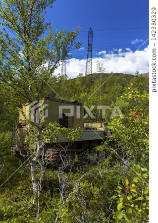 Old Soviet GT-SM GAZ-71 tracked all-terrain vehicle overgrown in forest in Murmansk Oblast, Russia Old Soviet GT-SM GAZ-71 tracked all-terrain vehicle overgrown in forest in Murmansk Oblast, Russia 142380329