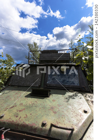 Old Soviet GT-SM GAZ-71 tracked all-terrain vehicle overgrown in forest in Murmansk Oblast, Russia 142380330