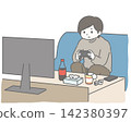 A man engrossed in a game on the sofa. 142380397