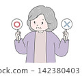 An elderly woman is troubled, holding a checkmark and crossed bills. 142380403