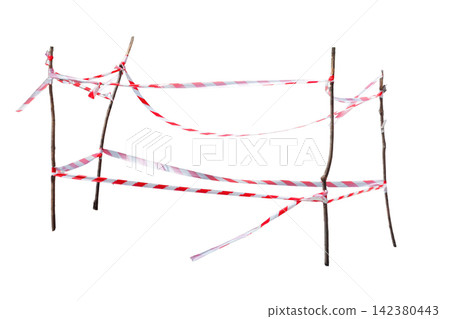 Temporary barrier made of wooden sticks and red and white caution tape isolated on a white background. Safety, restriction, and construction concept Temporary barrier made of wooden sticks and red and white caution tape isolated on a white background. Safety, restriction, and construction concept 142380443
