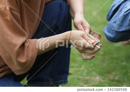 A woman making chopsticks from bamboo A woman making chopsticks from bamboo 142380598