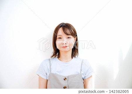 Portrait of a young woman working with a smile 142382005
