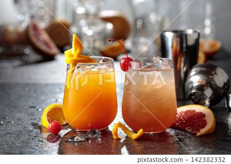 Summer refreshing cocktails with ice, orange and grapefruit juice. Summer refreshing cocktails with ice, orange and grapefruit juice. 142382332