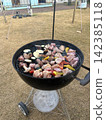 Grilling beef on a barbecue 142385118