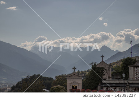 Italian alps cemetery with chapels and mountain landscape 142385227
