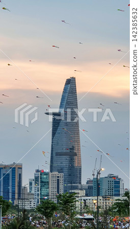 Kites On The Sky With Skyscrapers In Central Of Ho Chi Minh City At Sunset, Vietnam. Kites On The Sky With Skyscrapers In Central Of Ho Chi Minh City At Sunset, Vietnam. 142385632