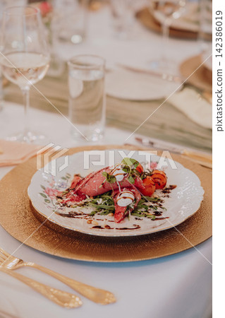 Gourmet dining experience with exquisite dish presentation. Fine wedding dining and culinary art. Gourmet dining experience with exquisite dish presentation. Fine wedding dining and culinary art. 142386019