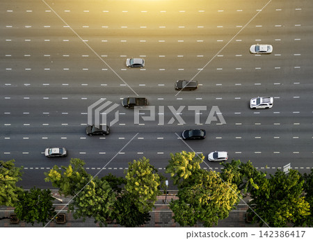 Aerial, road and highway with vehicles for transportation, traffic flow or infrastructure. Outdoor, empty and driving on street for travel destination, commute or environment. Aerial, road and highway with vehicles for transportation, traffic flow or infrastructure. Outdoor, empty and driving on street for travel destination, commute or environment. 142386417