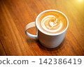 Hot latte coffee put on table in cafe restaurant, drink breakfast in the morning day. 142386419